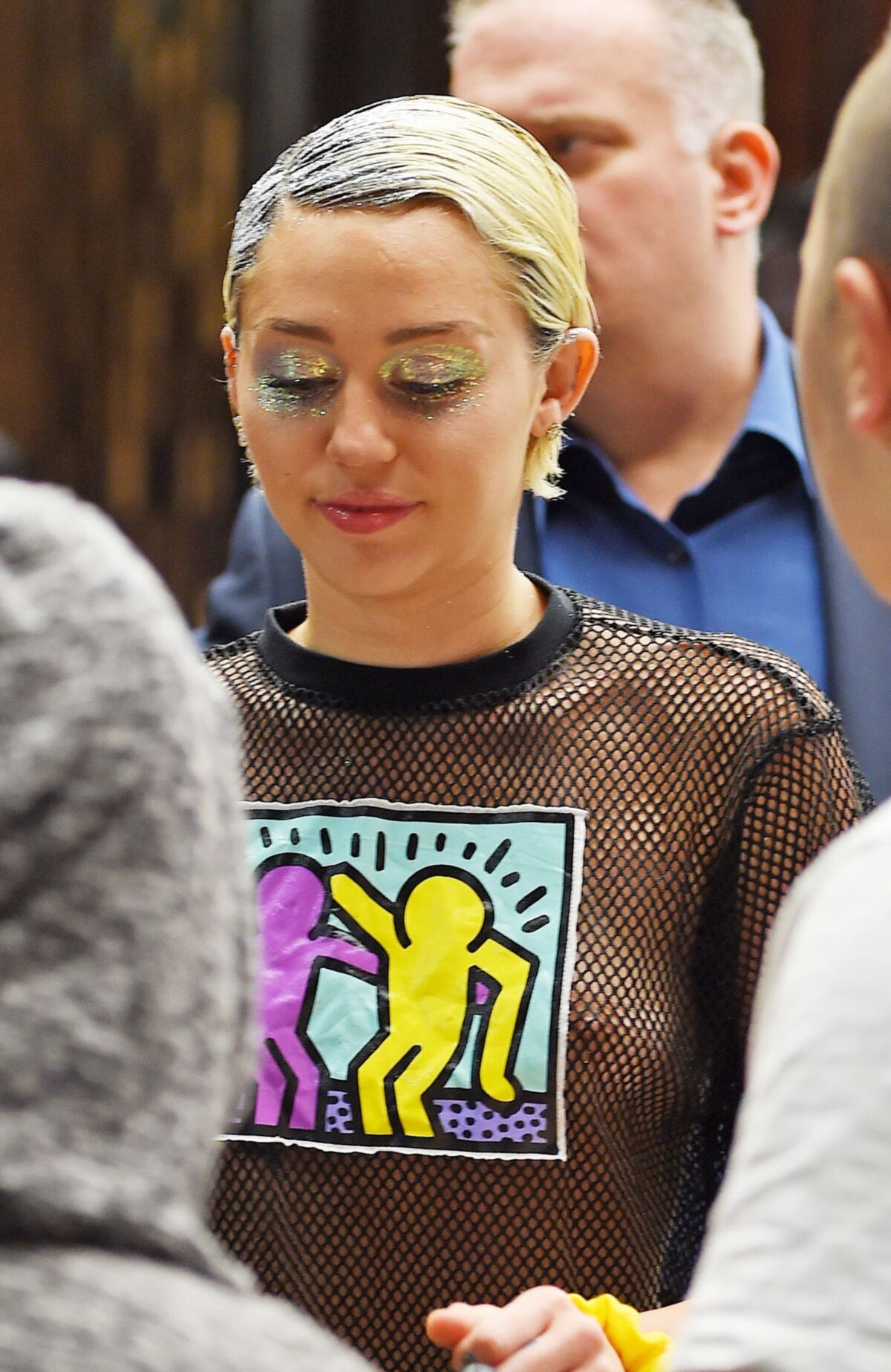 Miley Cyrus see through shirt in public