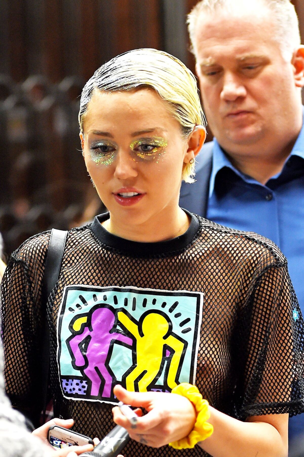 Miley Cyrus see through shirt in public