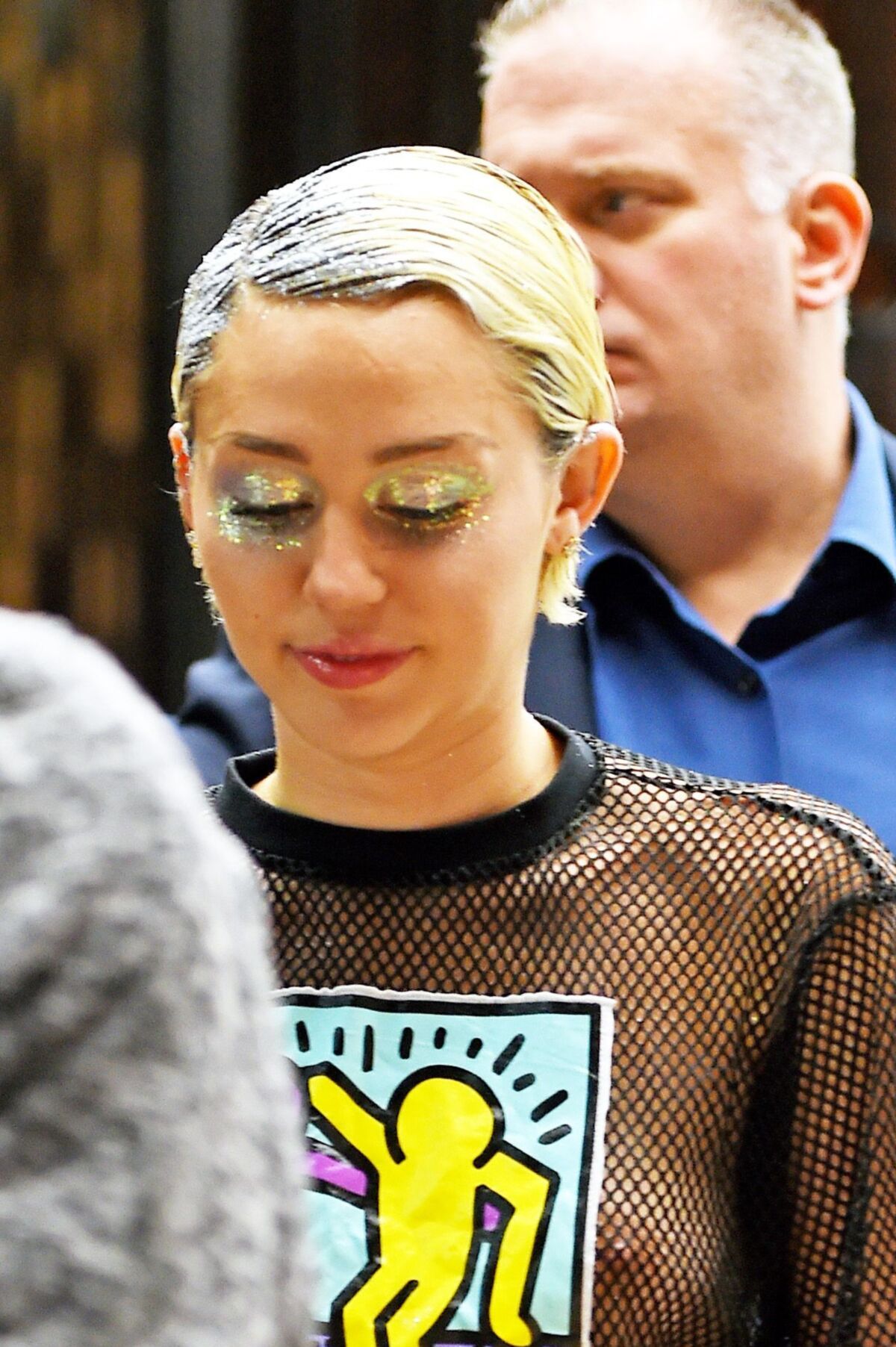 Miley Cyrus see through shirt in public