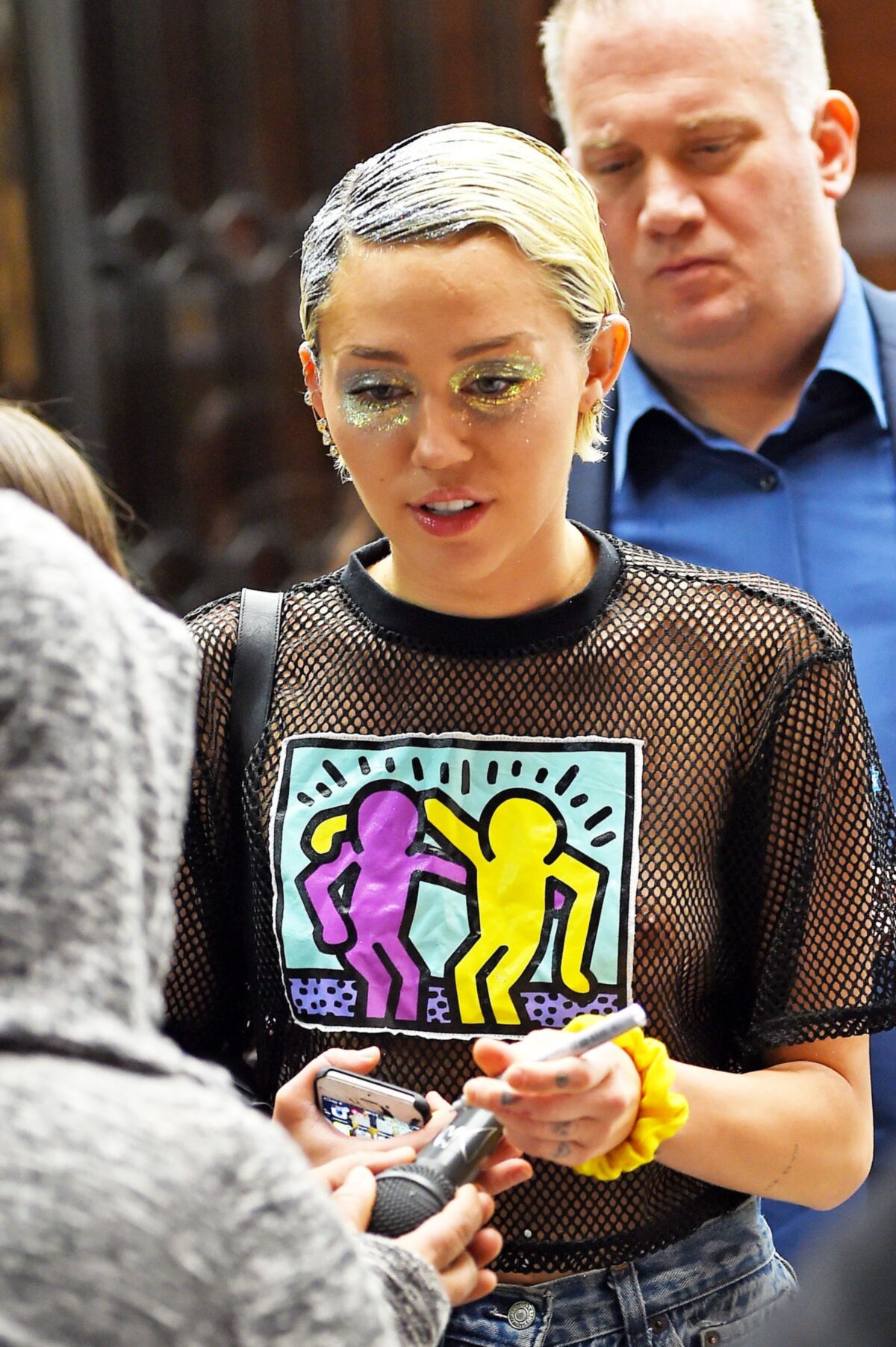 Miley Cyrus see through shirt in public