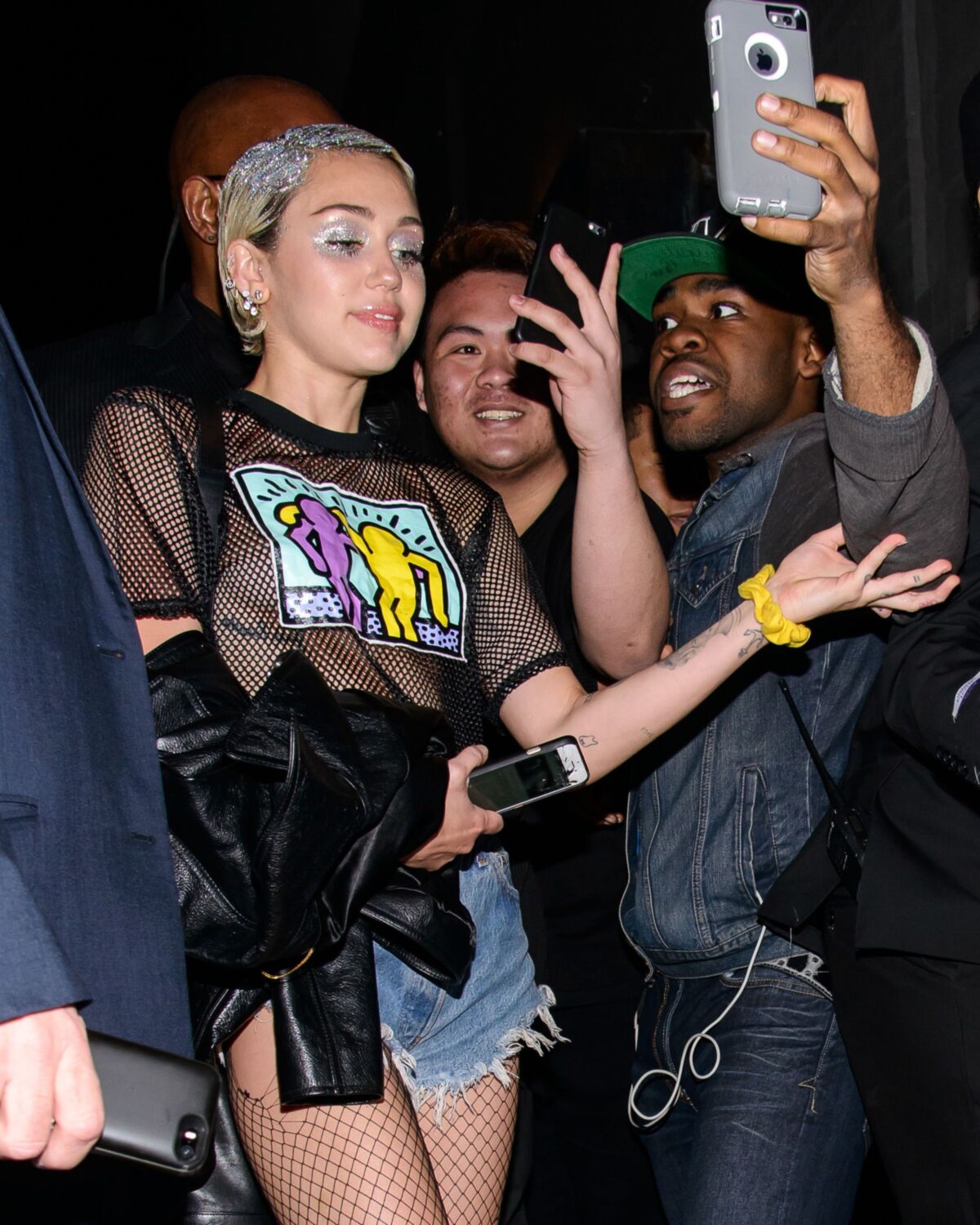 Miley Cyrus see through shirt in public