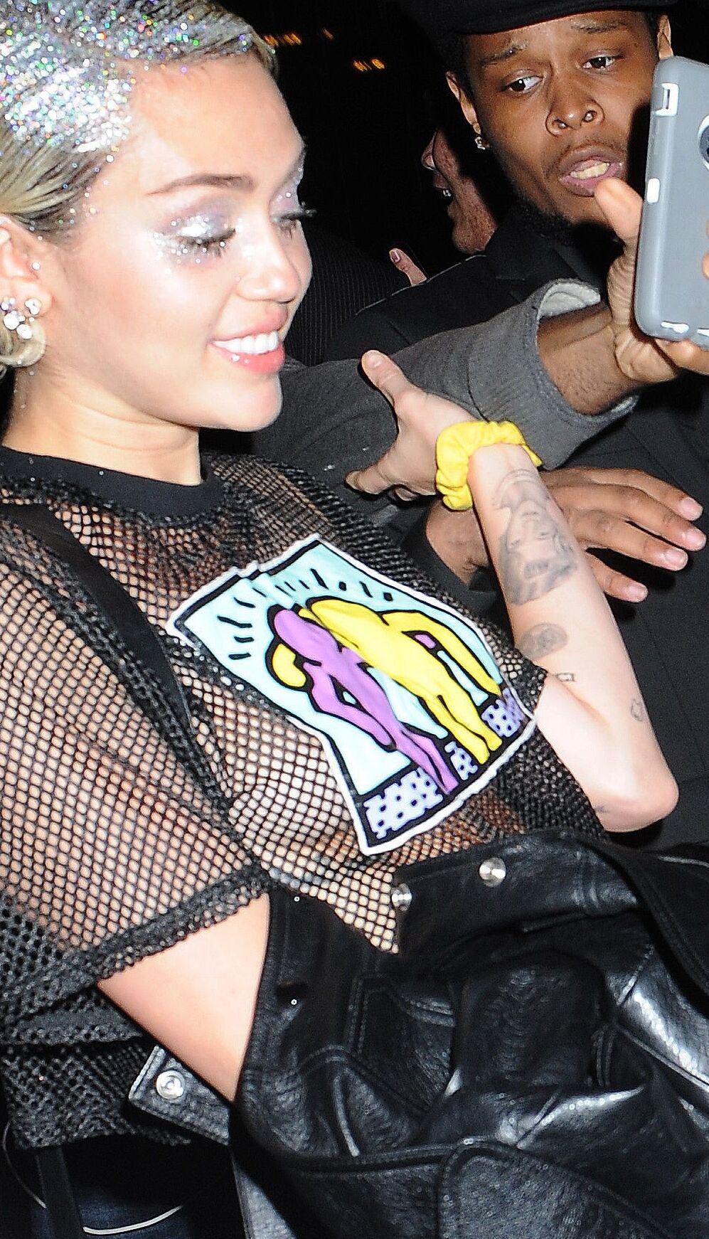 Miley Cyrus see through shirt in public