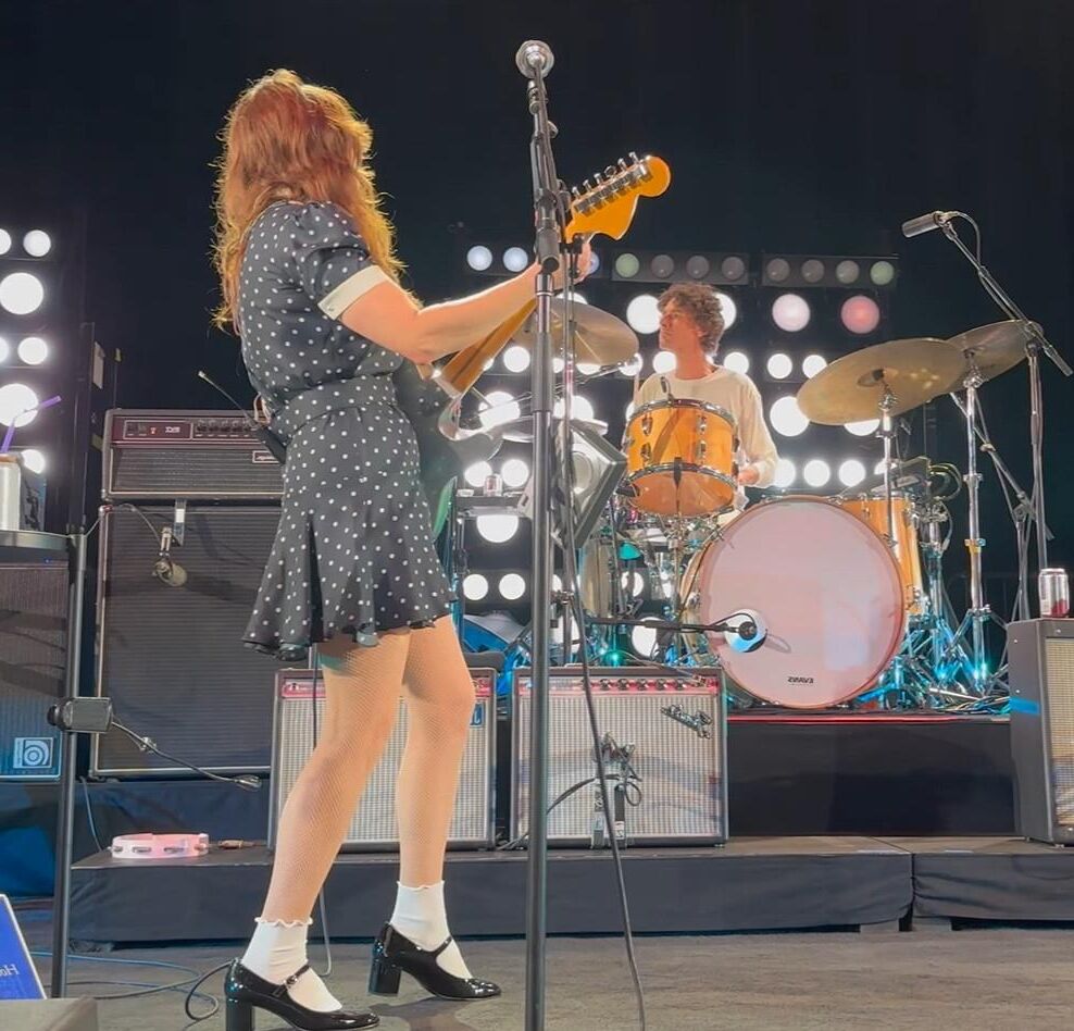 Jenny Lewis in fishnets, frilly white socks, and mary jane heels