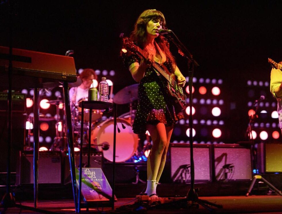 Jenny Lewis in fishnets, frilly white socks, and mary jane heels