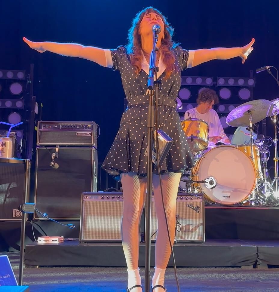 Jenny Lewis in fishnets, frilly white socks, and mary jane heels