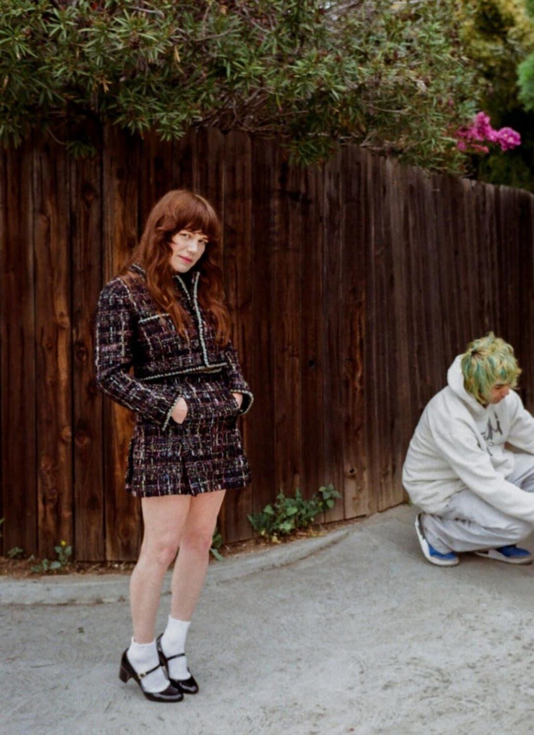 Jenny Lewis in fishnets, frilly white socks, and mary jane heels