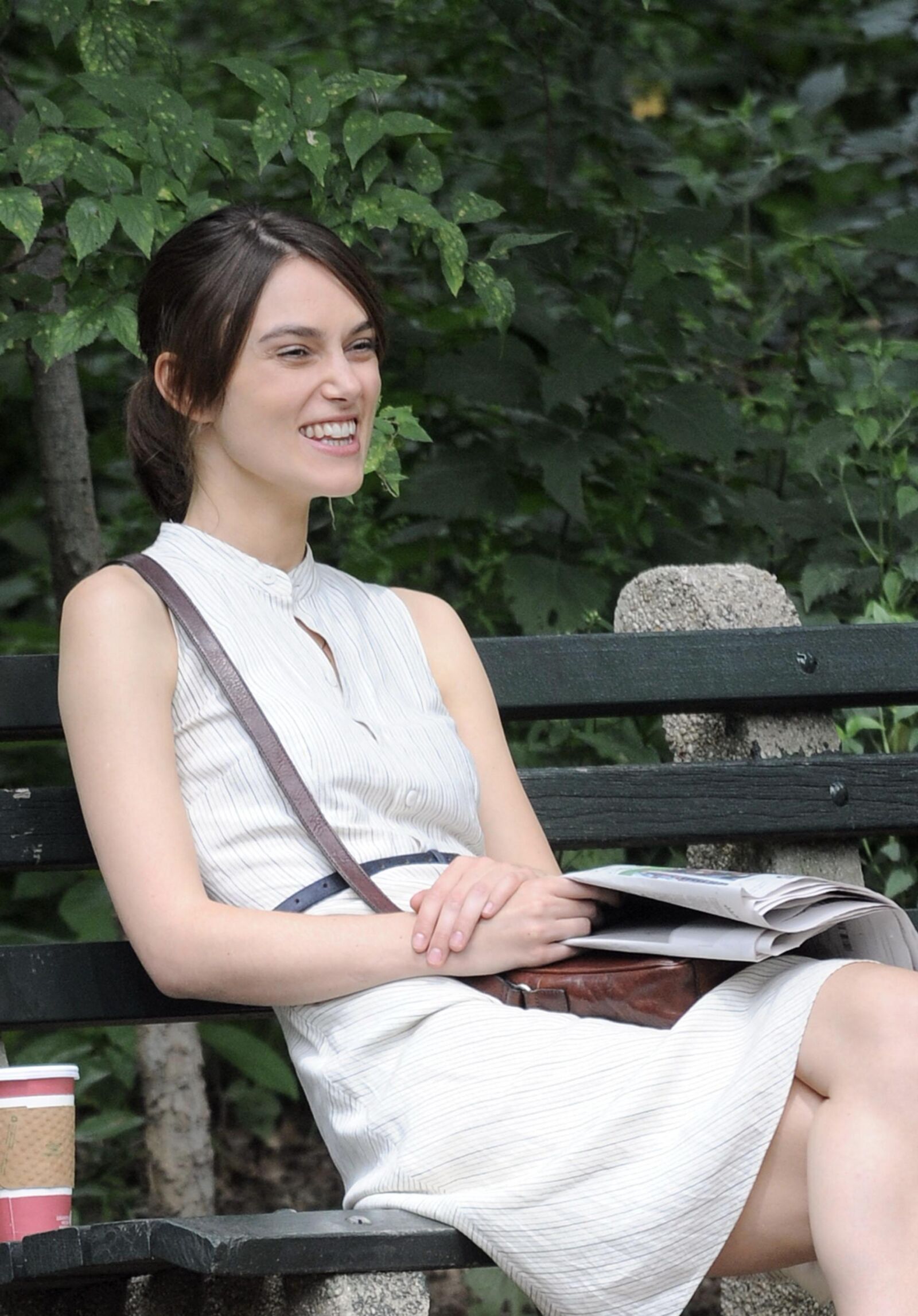 Kiera and her newspaper in the park 