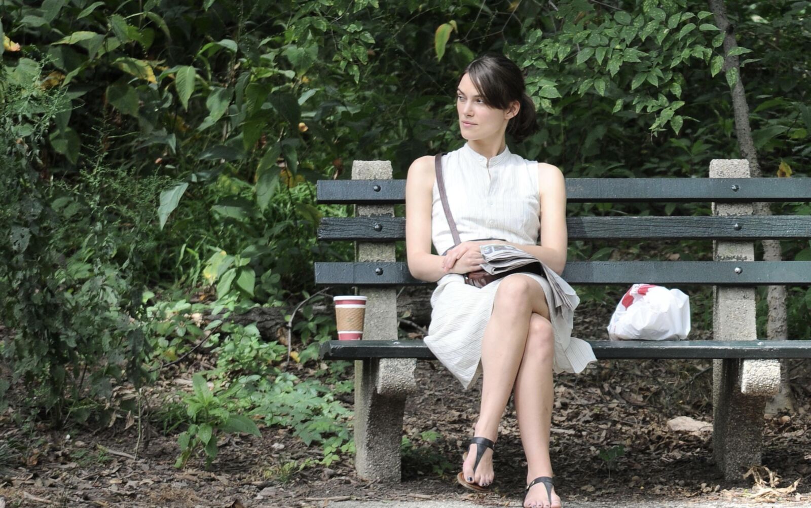Kiera and her newspaper in the park 