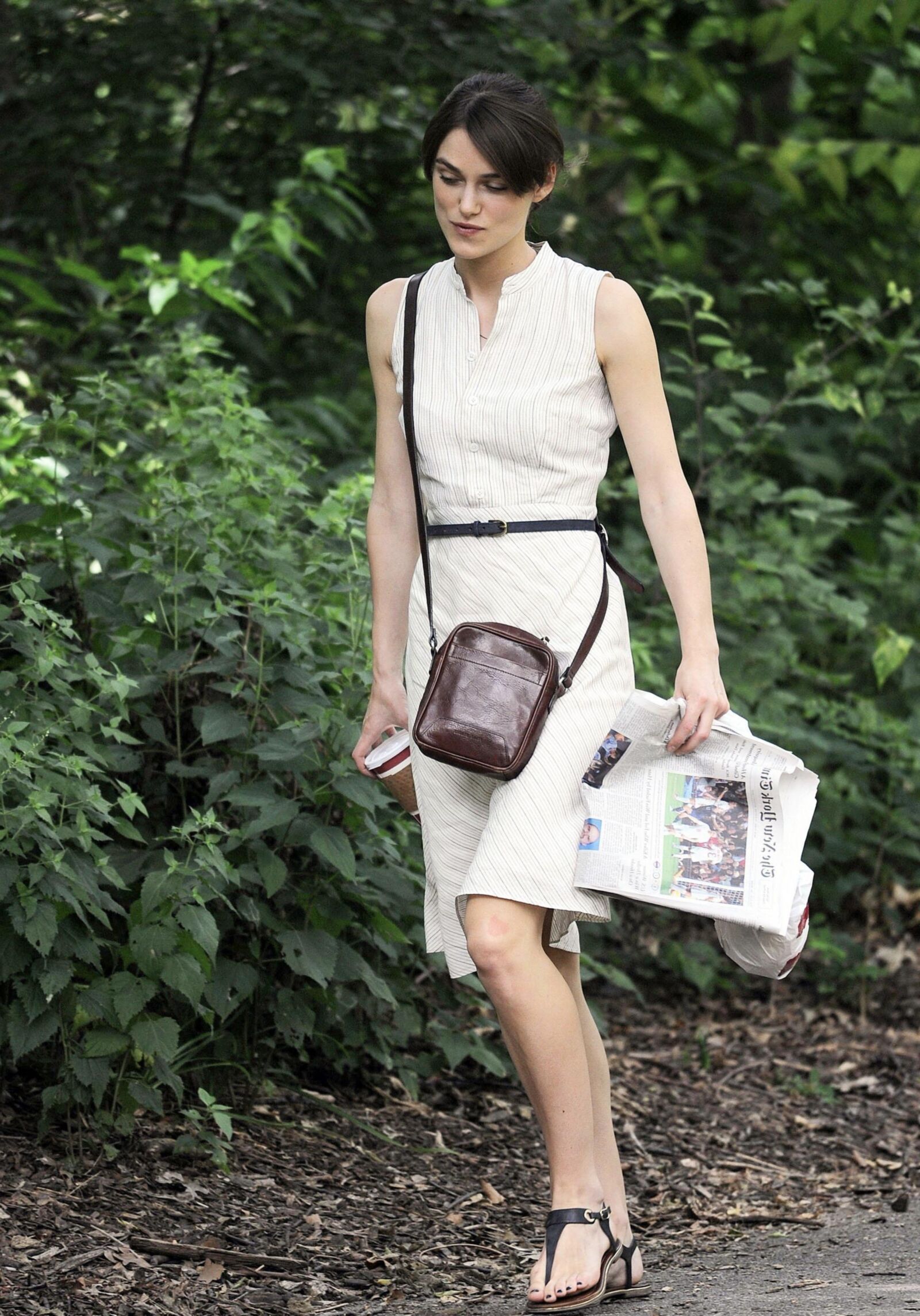 Kiera and her newspaper in the park 
