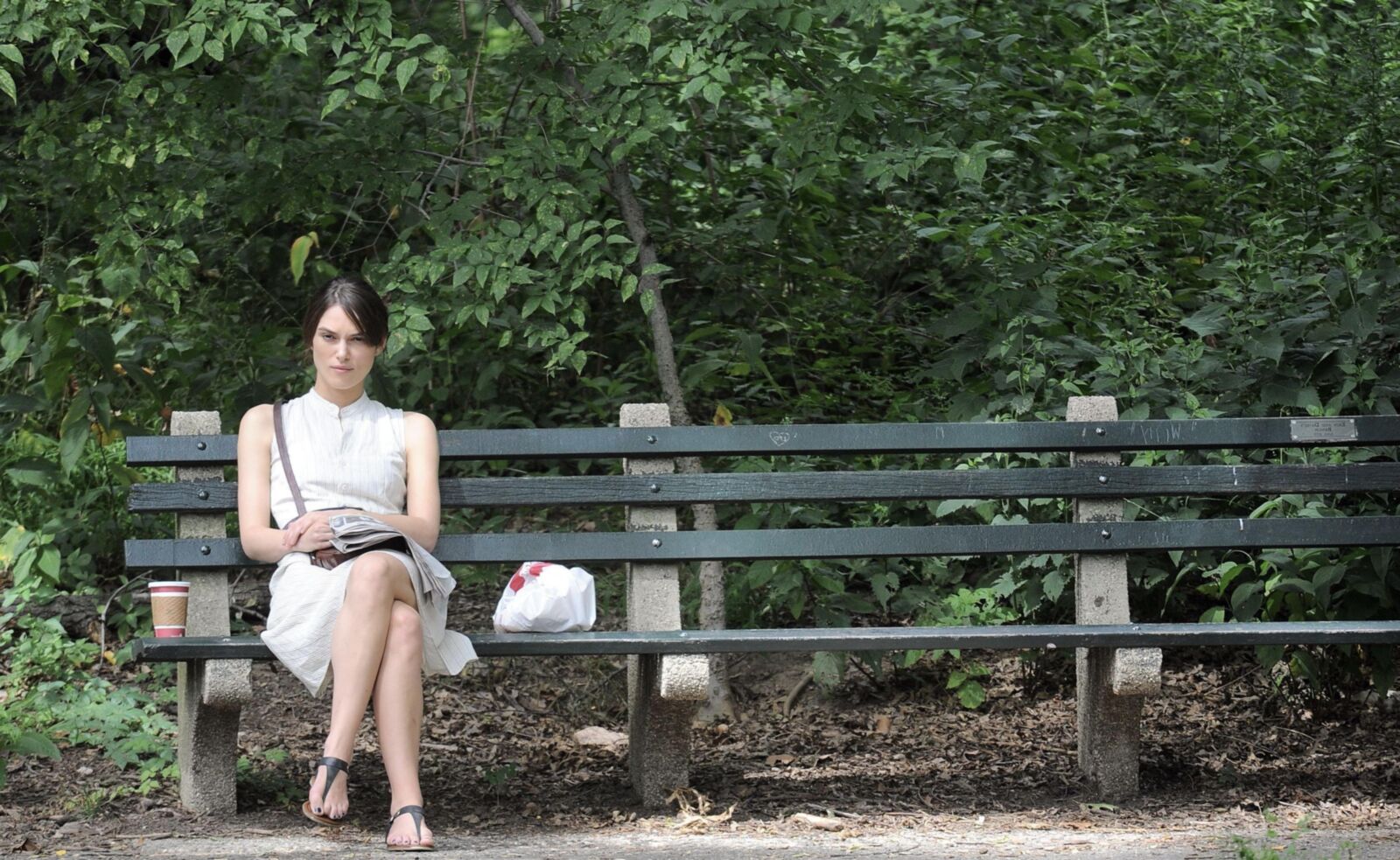 Kiera and her newspaper in the park 