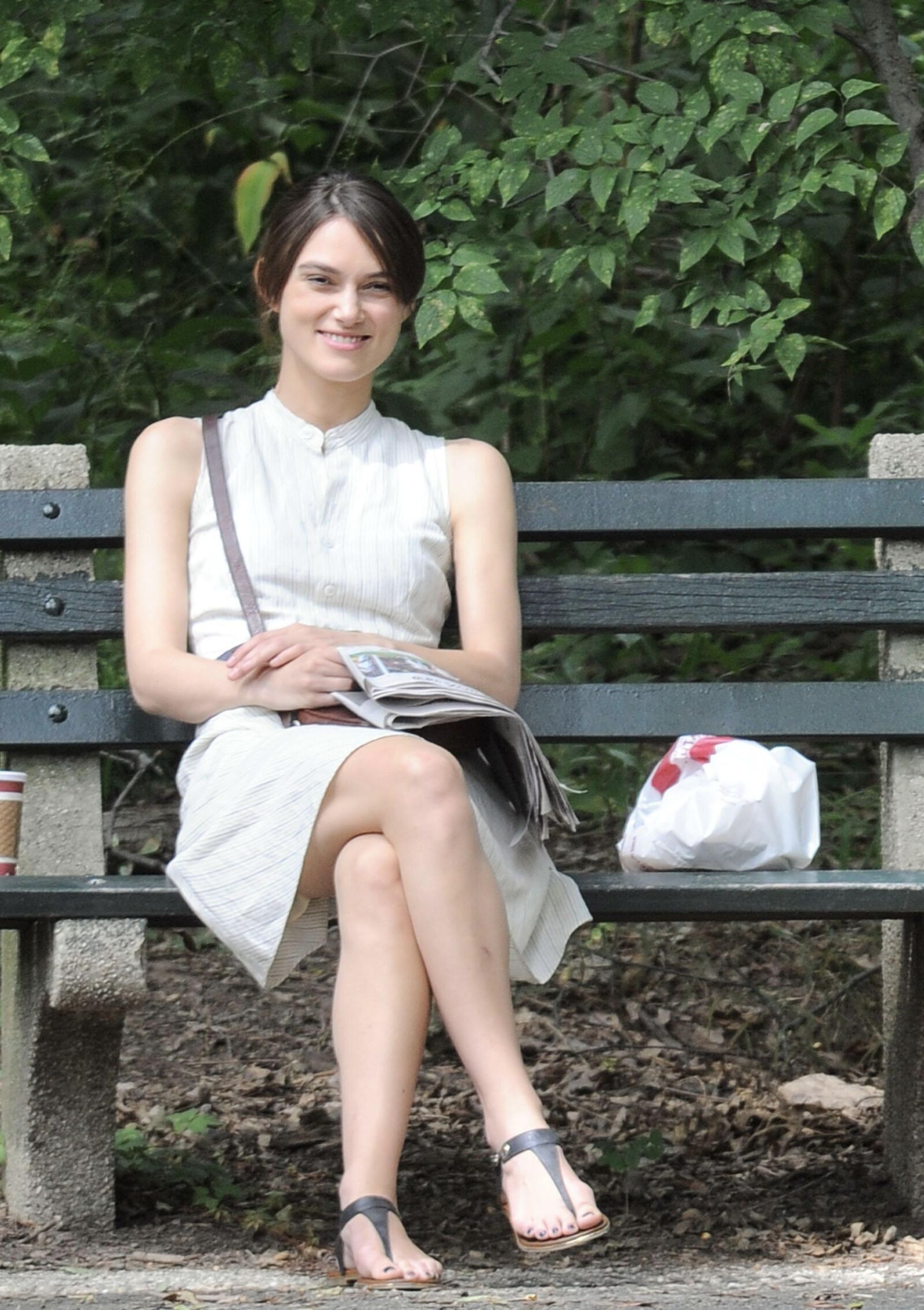Kiera and her newspaper in the park 