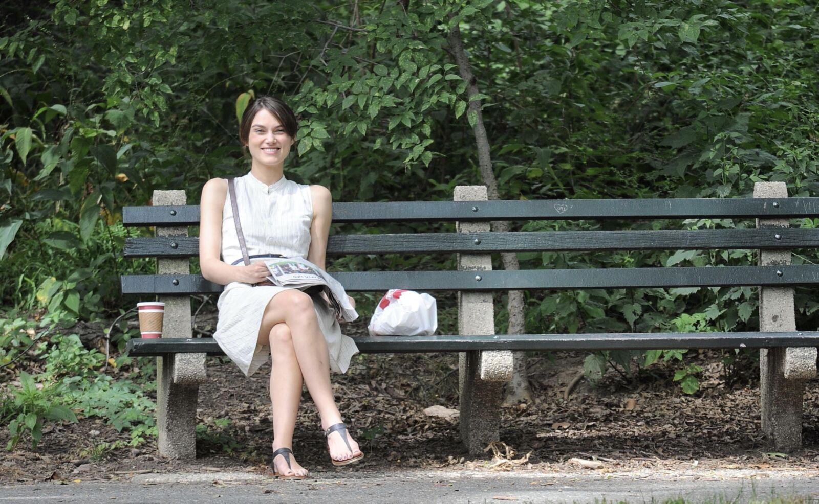 Kiera and her newspaper in the park 