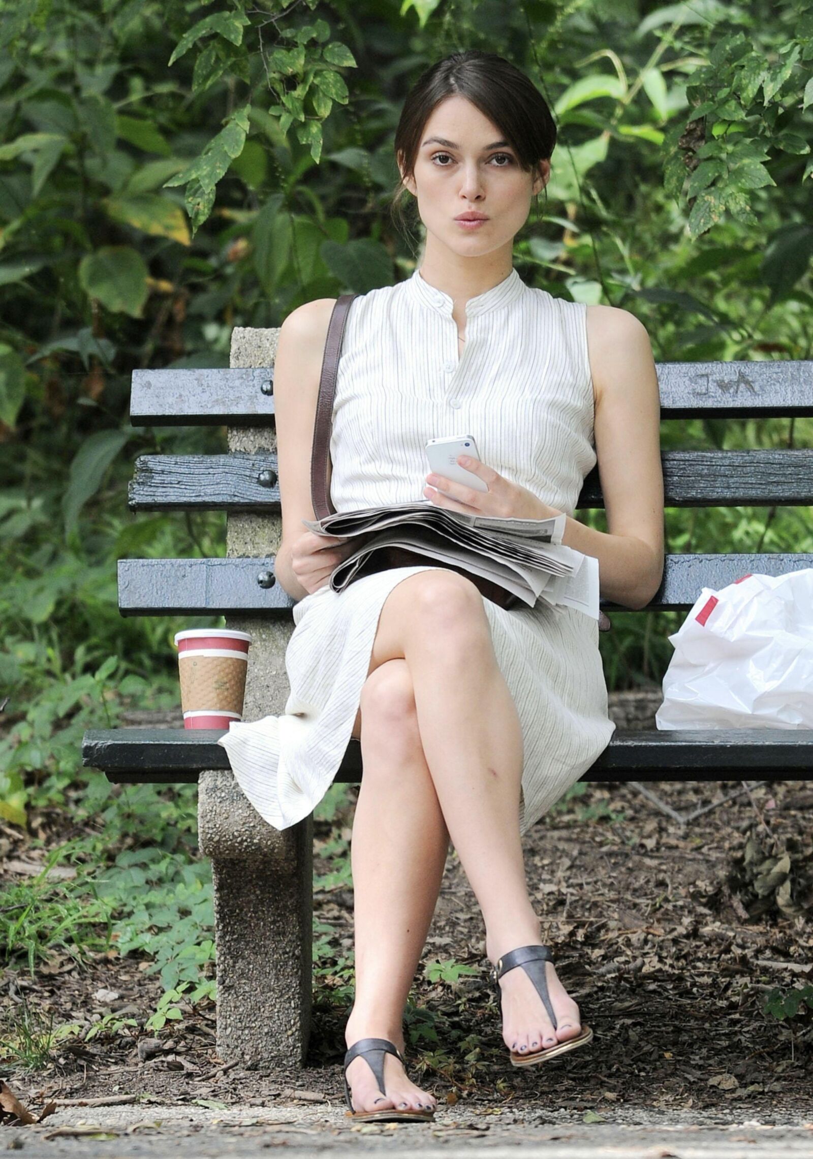 Kiera and her newspaper in the park 